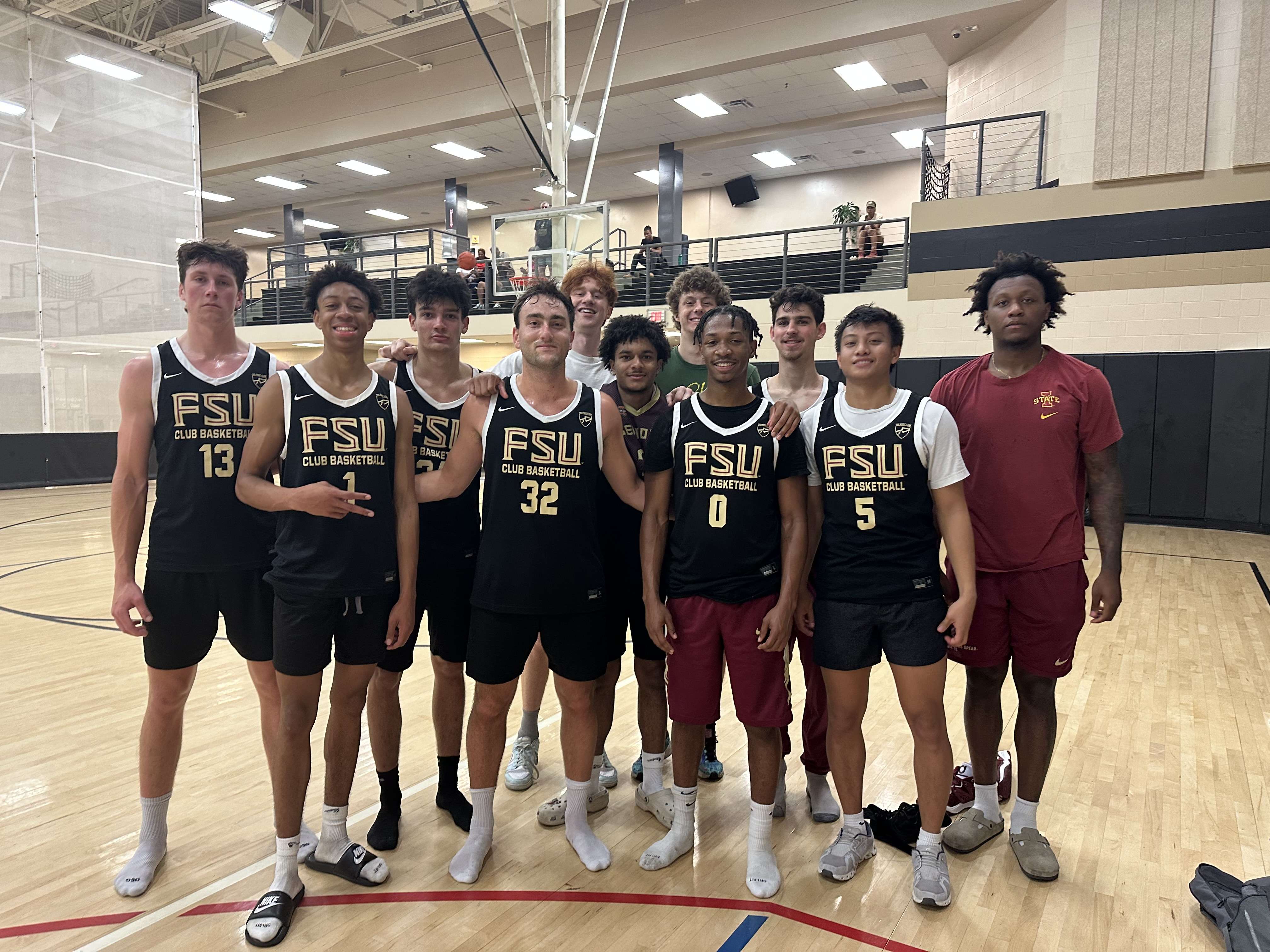 MensClubBasketballTeam Men's Club Basketball team smiling together after game