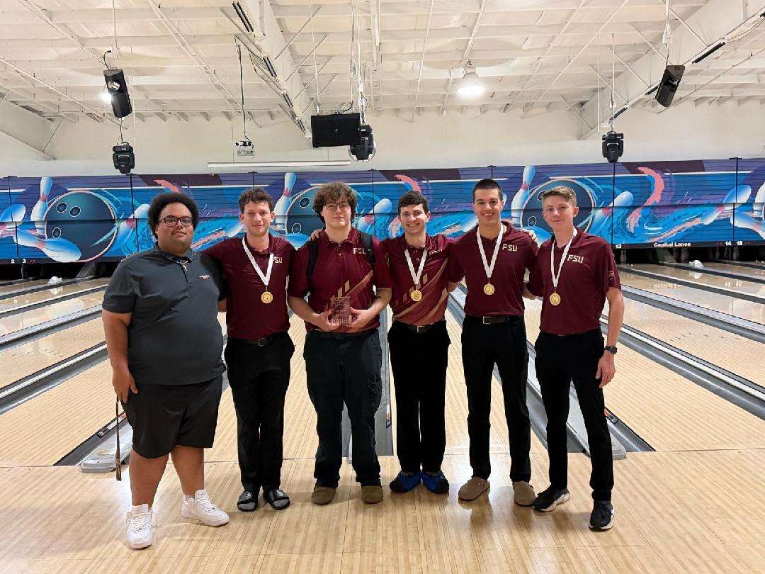 BowlingClubTeam FSU Bowling Club team with medals at bowling alley