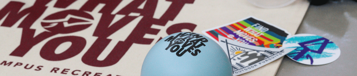 Campus Recreation towel, stress ball, and stickers laid out in a design