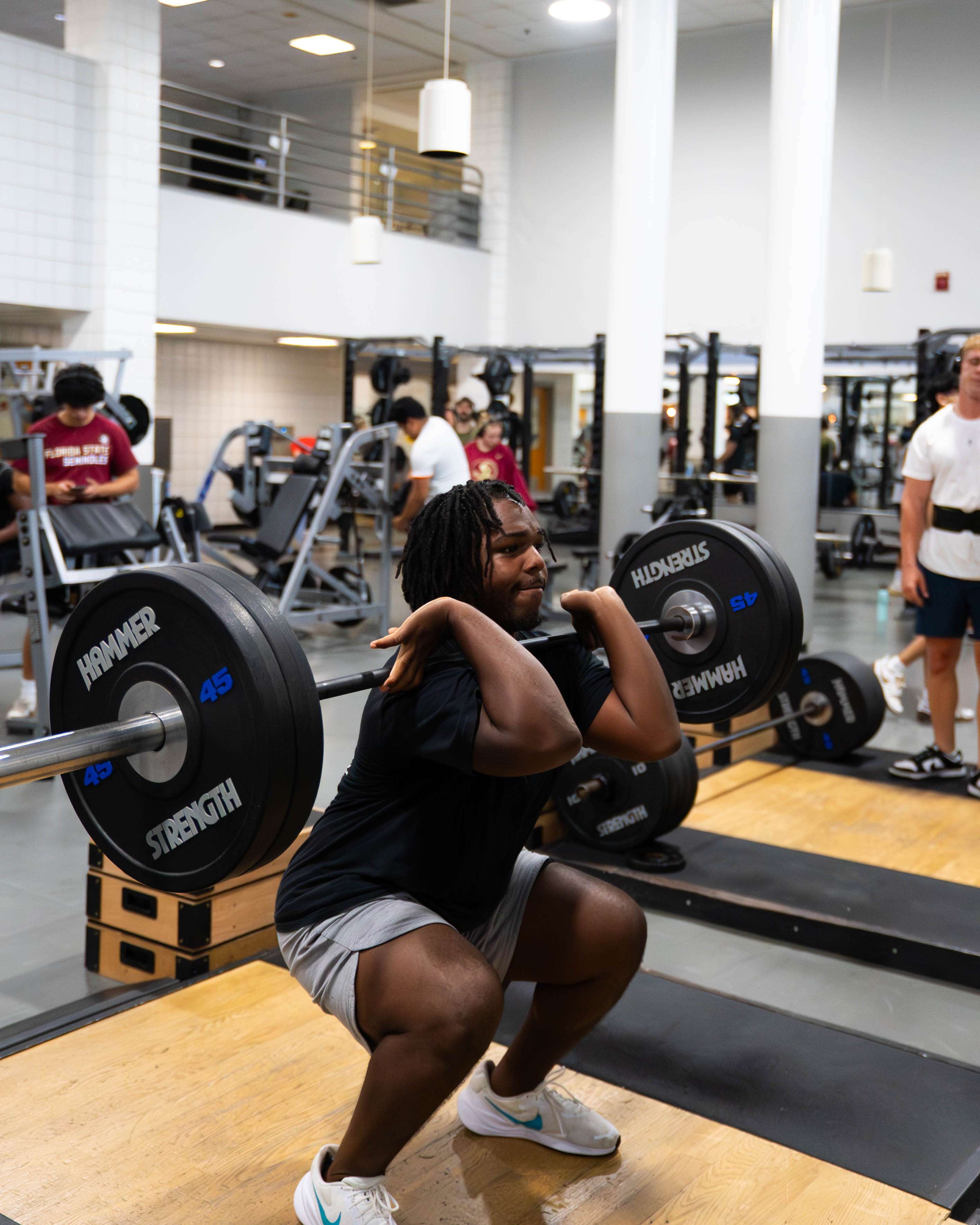 Summer Nights 2025- OL Challenge – DSC04515 FSU student completes a snatch lift on the Olympic Lifting platform at the Leach Center